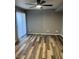 Living room features stylish wood flooring and a large sliding door at 19601 N 7Th N St # 1032, Phoenix, AZ 85024