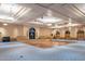 Expansive ballroom featuring hardwood dance floor, stage, and elegant lighting at 20183 N Big Dipper Dr, Maricopa, AZ 85138