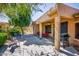 Enjoy outdoor living with this covered patio, complete with ceiling fan, seating, and a grill at 20183 N Big Dipper Dr, Maricopa, AZ 85138