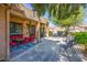 Covered patio with dining set and seating offers a perfect spot for outdoor relaxation and entertaining at 20183 N Big Dipper Dr, Maricopa, AZ 85138