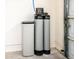 RainSoft water softening system installed next to the garage door at 20183 N Big Dipper Dr, Maricopa, AZ 85138