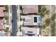 Birds eye view showcasing the property's pool and spa, solar panels, and the surrounding neighborhood layout at 20373 W Coolidge St, Buckeye, AZ 85396