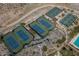 Aerial view of community tennis and pickleball courts surrounded by desert landscape and mountain views at 20373 W Coolidge St, Buckeye, AZ 85396