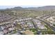 Expansive aerial view of a meticulously planned community with mountain views and well-maintained roads at 20373 W Coolidge St, Buckeye, AZ 85396