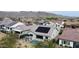 Aerial view highlighting the backyard's pool, outdoor living spaces, and solar panels enhancing this home's modern appeal at 20373 W Coolidge St, Buckeye, AZ 85396