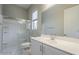 The bathroom includes a glass-enclosed shower, toilet, and vanity with a large mirror at 20373 W Coolidge St, Buckeye, AZ 85396