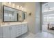 This bathroom features double sinks, modern lighting, and access to the shower at 20373 W Coolidge St, Buckeye, AZ 85396