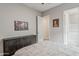 A spacious bedroom boasts a decorative dresser and easy access to the en suite bathroom at 20373 W Coolidge St, Buckeye, AZ 85396