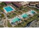 Aerial shot showcasing multiple sparkling pools with ample lounge areas, palm trees, and manicured grounds at 20373 W Coolidge St, Buckeye, AZ 85396