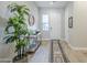 Inviting entryway featuring light tile floors, a stylish console table, and a decorative rug runner at 20373 W Coolidge St, Buckeye, AZ 85396