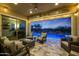 Charming covered patio with comfortable seating, overlooking a beautiful pool and landscape for relaxing outdoor living at 20373 W Coolidge St, Buckeye, AZ 85396