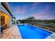 Beautiful backyard featuring a refreshing blue pool, perfect for relaxation and enjoying the outdoors at 20373 W Coolidge St, Buckeye, AZ 85396