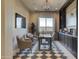 Stylish home office with built-in shelving, modern lighting, and ample natural light at 20445 W Rovey Ave, Buckeye, AZ 85396