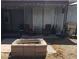 Backyard patio area with lounge chairs, grill, and fire pit for outdoor enjoyment at 22744 E Carla Vista Dr, Mesa, AZ 85212