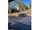 Backyard features desert landscaping with a tiled patio and built-in fire pit at 22744 E Carla Vista Dr, Mesa, AZ 85212