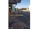 Extended gravel driveway and covered area ideal for parking or workshop, ready for customization at 22744 E Carla Vista Dr, Mesa, AZ 85212