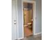 A bathroom with a glass shower and standard toilet with wood cabinets at 22744 E Carla Vista Dr, Mesa, AZ 85212