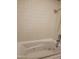 Bathroom featuring a jacuzzi tub with jets and tiled walls at 22744 E Carla Vista Dr, Mesa, AZ 85212