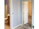 Bathroom with toilet and vanity; doorway to another room at 22744 E Carla Vista Dr, Mesa, AZ 85212