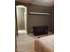 This is a spacious bedroom that features wood flooring and a half bathroom at 22744 E Carla Vista Dr, Mesa, AZ 85212