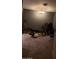 A spacious exercise room includes exercise machines and carpeted floor at 22744 E Carla Vista Dr, Mesa, AZ 85212