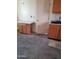 The kitchen area boasts wood cabinets and granite countertops with a sink and a window at 22744 E Carla Vista Dr, Mesa, AZ 85212