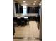 Bright kitchen with stainless steel appliances, light granite countertops, and dark wood cabinets at 22744 E Carla Vista Dr, Mesa, AZ 85212