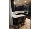 Beautiful kitchen with stainless steel appliances, granite countertops, and dark wood cabinets at 22744 E Carla Vista Dr, Mesa, AZ 85212