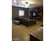 Spacious living room with a large sofa, TV, and bookshelves for Gathering entertainment at 22744 E Carla Vista Dr, Mesa, AZ 85212