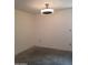 An empty room is illuminated by a modern ceiling light, electrical outlets, and neutral walls at 22744 E Carla Vista Dr, Mesa, AZ 85212