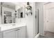 Bright bathroom boasts a stylish vanity, sleek fixtures, and practical shelving to maximize space at 22787 W Gardenia Dr, Buckeye, AZ 85326