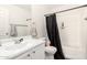 The bathroom is complete with a vanity and a shower/tub combo with a curtain for privacy at 22787 W Gardenia Dr, Buckeye, AZ 85326