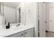 Bright bathroom boasts a stylish vanity, sleek fixtures, and modern gray flooring at 22787 W Gardenia Dr, Buckeye, AZ 85326