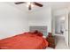 Cozy bedroom features soft carpet, neutral walls, and a ceiling fan for a comfortable atmosphere at 22787 W Gardenia Dr, Buckeye, AZ 85326