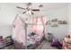 Charming ' room with a whimsical canopy bed, playful decor, and ceiling fan at 22787 W Gardenia Dr, Buckeye, AZ 85326