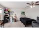 A bedroom featuring carpet, ceiling fan, a bed, and a window view of the exterior at 22787 W Gardenia Dr, Buckeye, AZ 85326