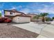 Charming two-story home featuring a red tile roof and spacious two-car garage at 22787 W Gardenia Dr, Buckeye, AZ 85326