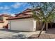 Charming two-story home featuring a red tile roof and spacious two-car garage at 22787 W Gardenia Dr, Buckeye, AZ 85326