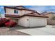 Charming two-story home featuring a red tile roof and spacious two-car garage at 22787 W Gardenia Dr, Buckeye, AZ 85326