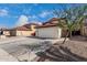 Charming two-story home featuring a red tile roof and spacious two-car garage at 22787 W Gardenia Dr, Buckeye, AZ 85326
