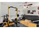 Home gym featuring exercise equipment and a fan. Perfect for workout enthusiasts! at 22787 W Gardenia Dr, Buckeye, AZ 85326