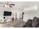 The spacious living area offers a modern ceiling fan, neutral paint, and hardwood floors at 22787 W Gardenia Dr, Buckeye, AZ 85326