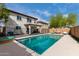Sparkling pool with backyard and view of the two-story house at 22787 W Gardenia Dr, Buckeye, AZ 85326