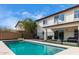 A sparkling pool with patio space and partial view of the house at 22787 W Gardenia Dr, Buckeye, AZ 85326