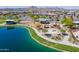 Aerial view of the community playground with a water tower and lake in a Primary-planned community at 23020 E Excelsior Ave, Queen Creek, AZ 85142