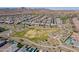 Expansive aerial view of a residential community, showcasing homes, parks, and desert landscaping at 23020 E Excelsior Ave, Queen Creek, AZ 85142