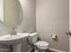 Powder room features a pedestal sink with oval mirror at 23020 E Excelsior Ave, Queen Creek, AZ 85142