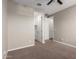 Neutral bedroom with carpet flooring and closet access at 23020 E Excelsior Ave, Queen Creek, AZ 85142