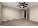 Spacious bedroom with modern ceiling fan and neutral color palette at 23020 E Excelsior Ave, Queen Creek, AZ 85142