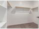 Walk-in closet with built-in shelves and clothing racks at 23020 E Excelsior Ave, Queen Creek, AZ 85142